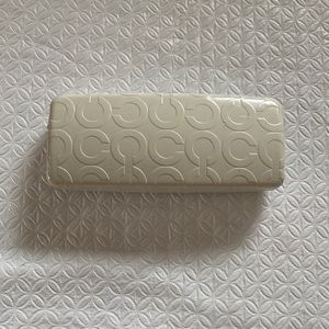 COACH hard eye glass‎ or sunglass case in cream with brown felt interior.